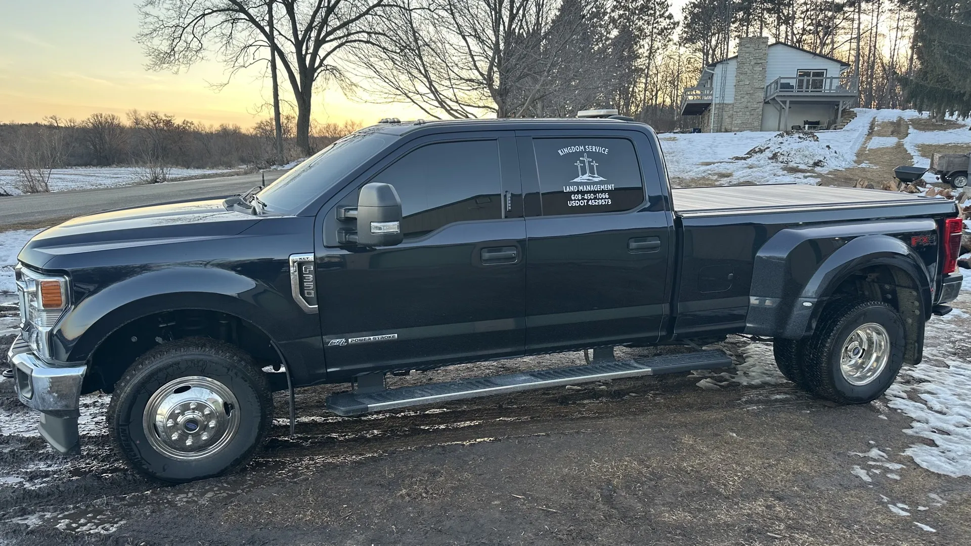 Kingdom Service branded truck and equipment ready for land clearing